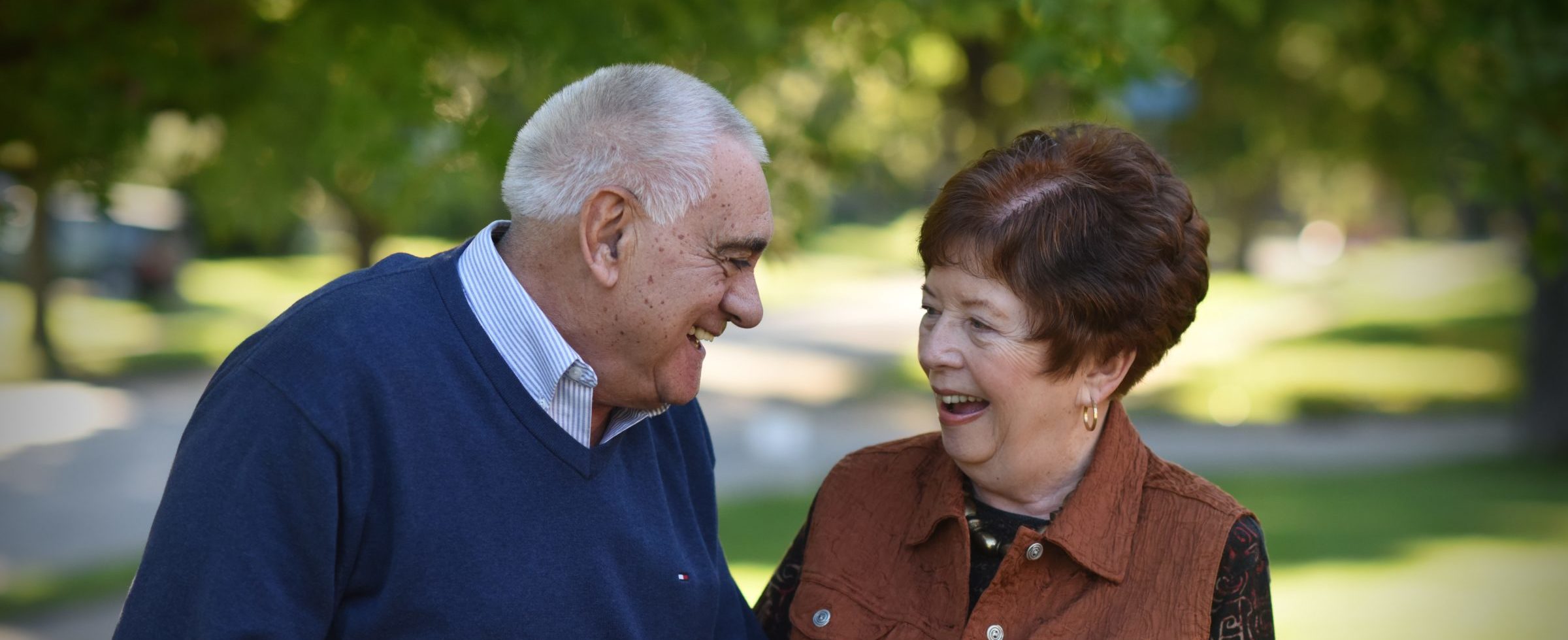 elderly man and woman talking