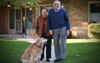 elderly couple and a dog